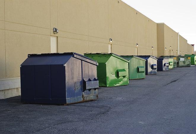 brightly colored dumpsters filled with construction waste in Bolingbrook, IL